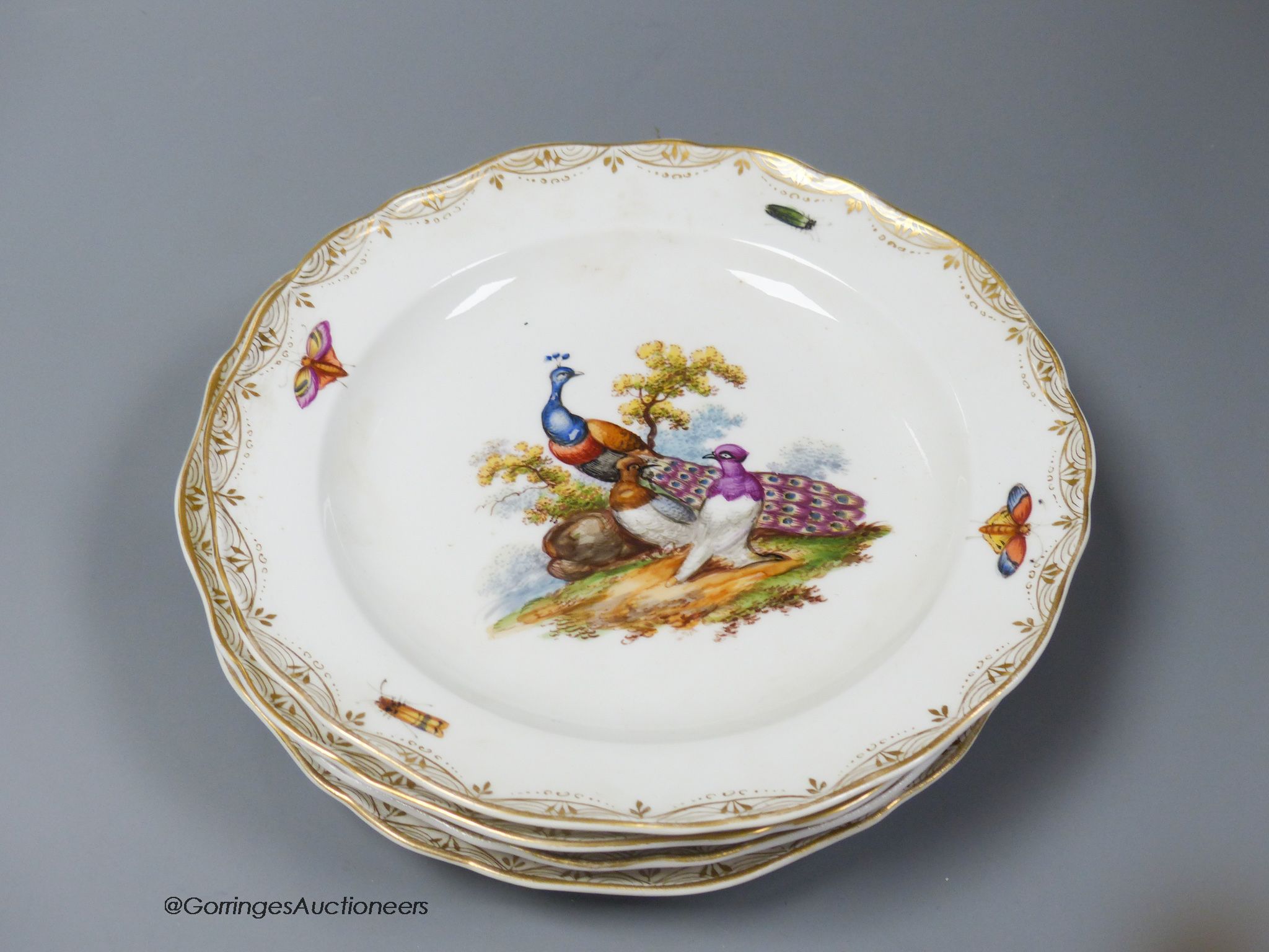 A set of six Meissen dessert dishes, painted with birds,factory seconds, 25.5cm diameter